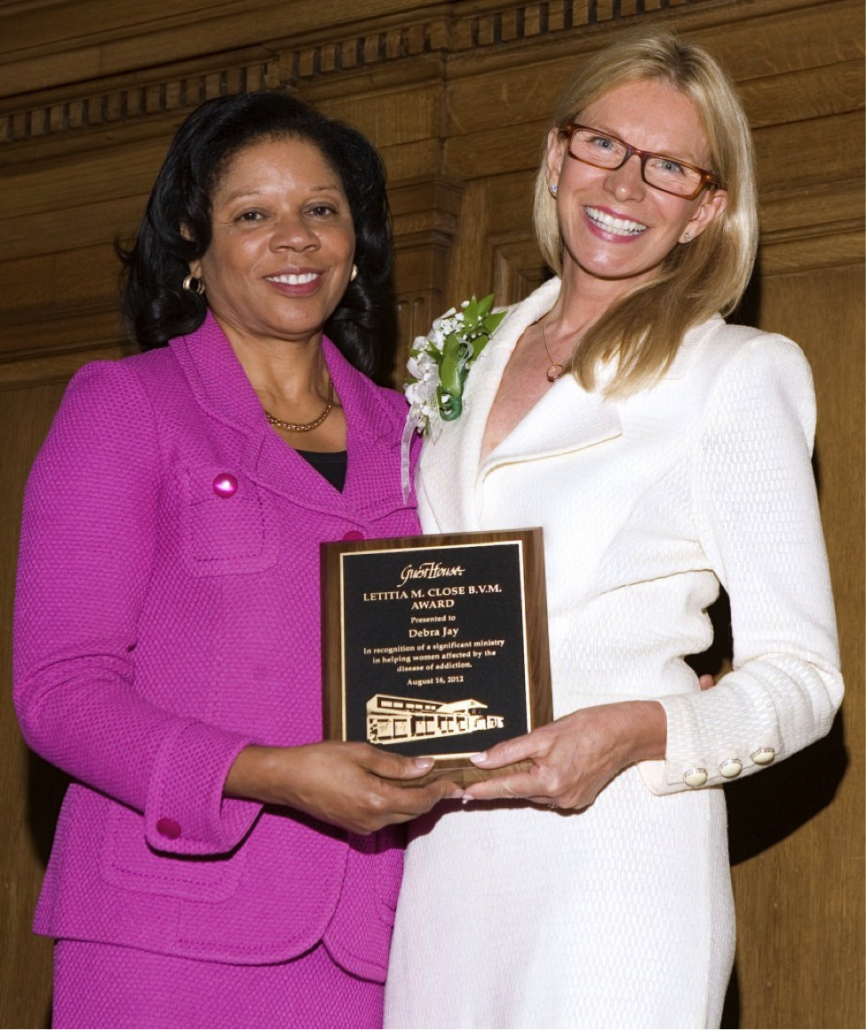 Debra Jay receives the Letitia Close Award from Dr. Patricia Maryland and the annual Bishop's Dinner in Detroit