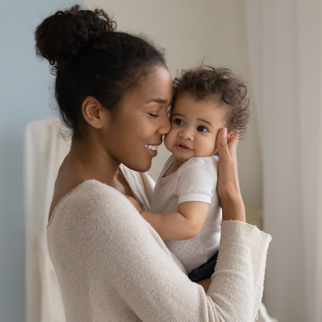 African American mom embracing her child