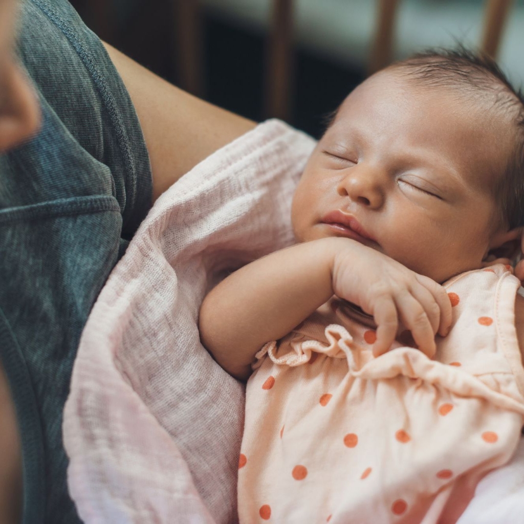 Infant in mother's arms